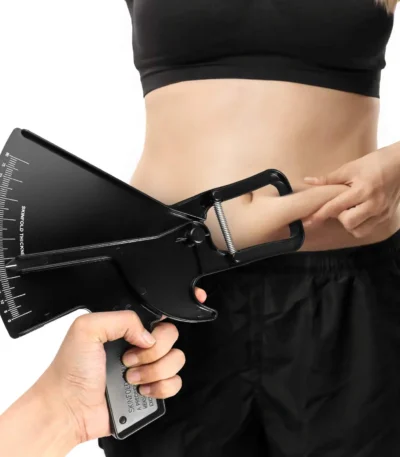 Skinfold body fat caliper measuring abdominal fat