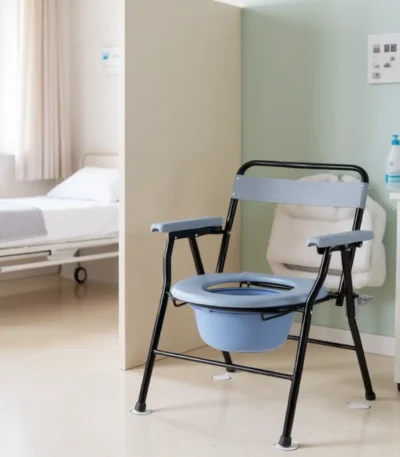 Portable commode chair with blue seat in hospital room.