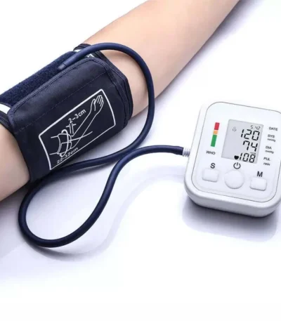 Digital upper arm blood pressure monitor with cuff showing readings on LCD screen.